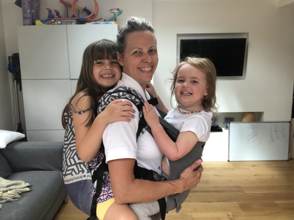 Deborah Moore tandem-carrying her two girls